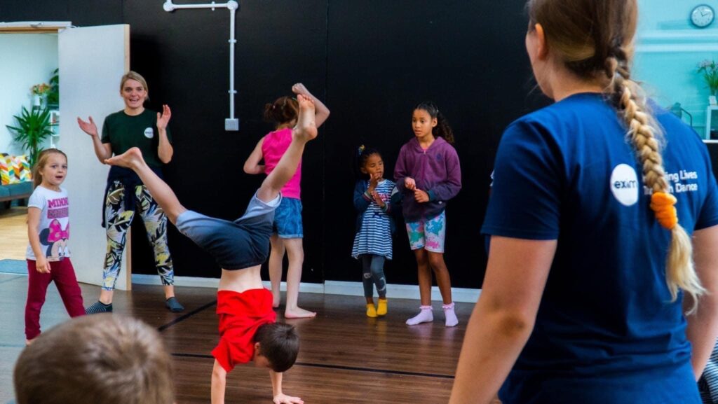 Children and teachers dancing