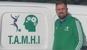 Joe posing beside van