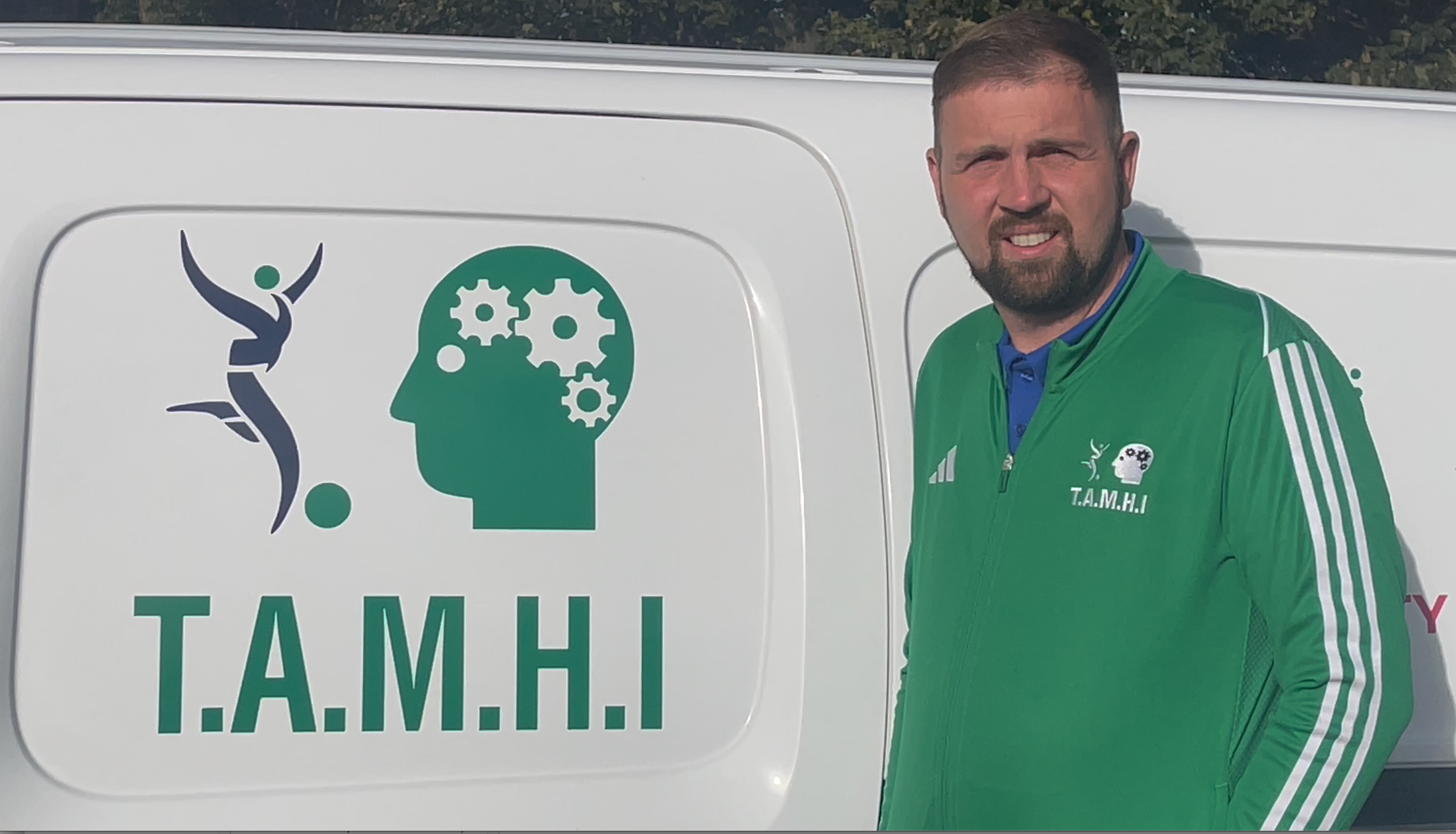 Joe posing beside van