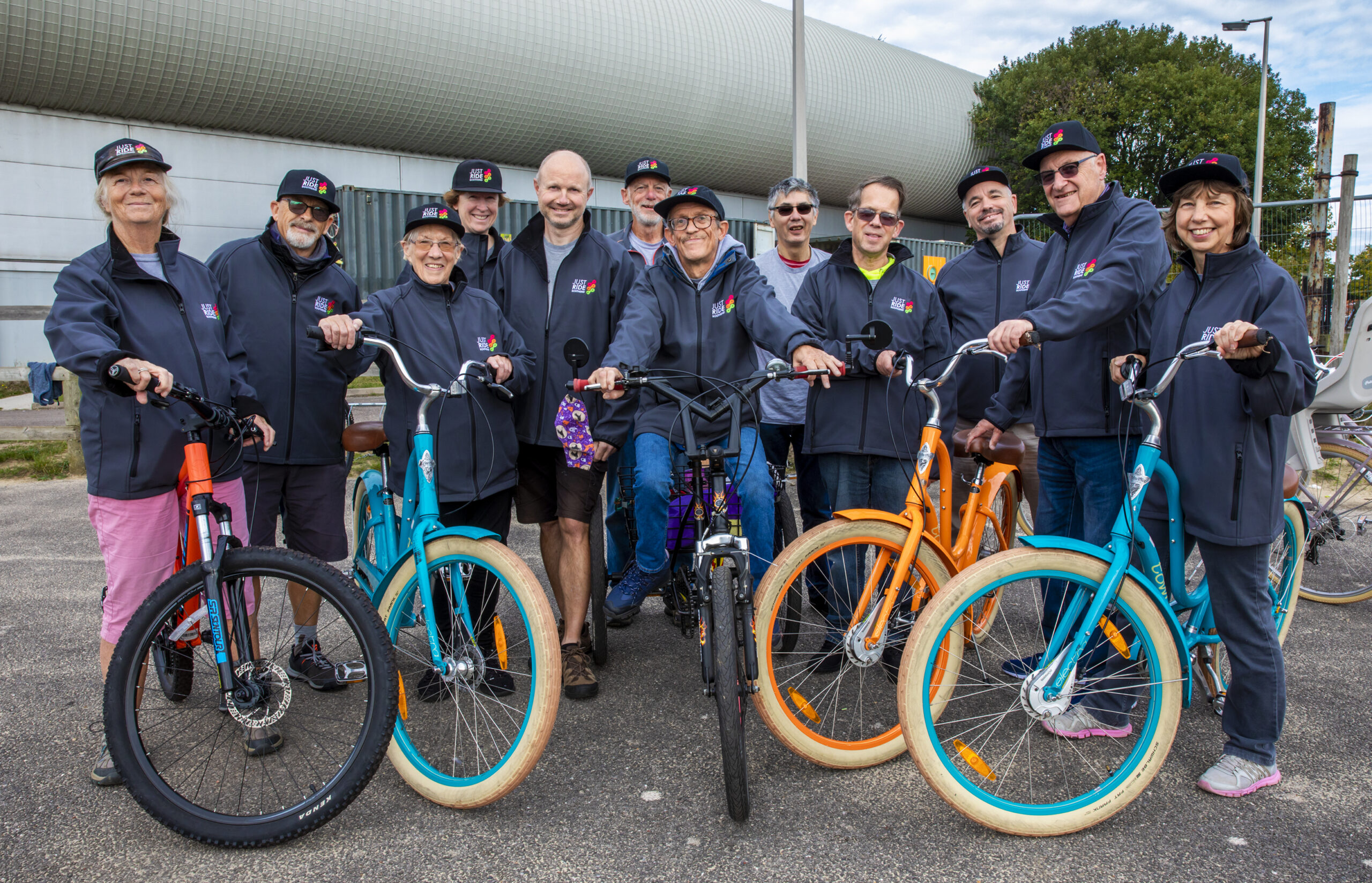 Group shot of cyclists with bikes