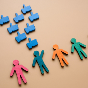 blue thumbs up facebook likes images with 4 coloured stick people below, one is waving