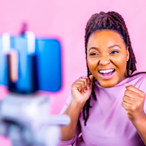 woman dancing while filming on a mobile phone