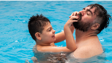 boy and man in a swimming pool