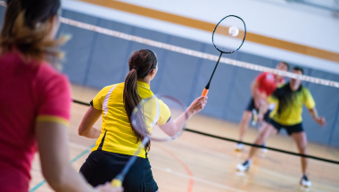 young woman playing badminton
